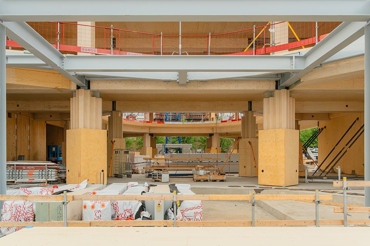 LVL, CLT, steel, and construction materials visible inside the Katajanokan Laituri building in Helsinki.